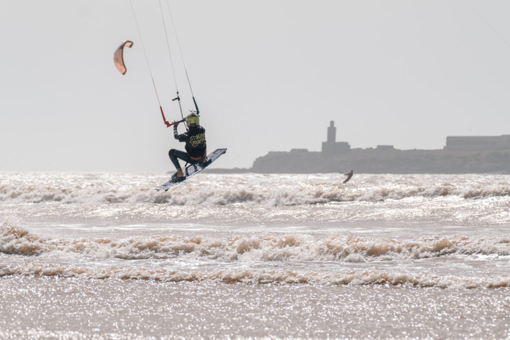 Kitesurfer in Essaouira, Morocco for Kite Maroc getting photographed by Salt Water Photos by Sustainable Surfer Girl Marketing